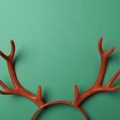 Beautiful reindeer headband on green background