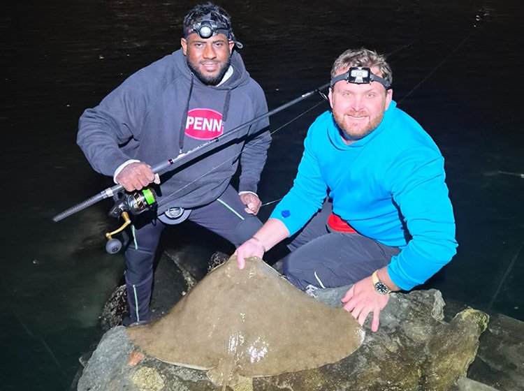 Benny Pillay and Max Stamatis with a brown ray caught off Scottburgh