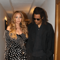 Beyonce and Jay Z posing in a hallway