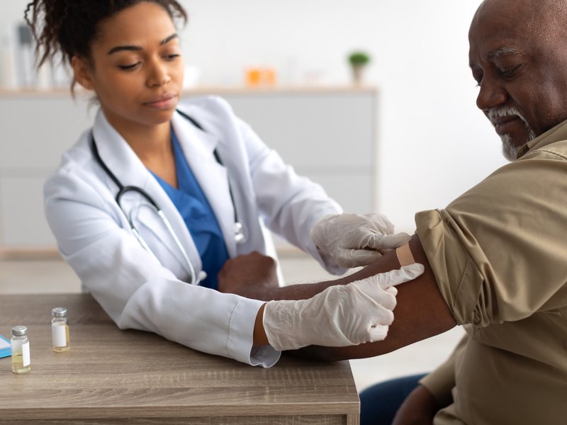 Black Mature Man Getting Vaccinated,