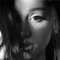 Black and white close up of Ariana Grande