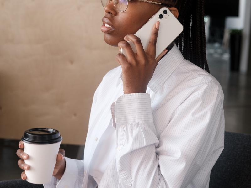 Black businesswoman speaking on smartphone