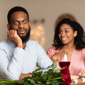 Black man on an unsuccessful first date at a restaurant with a woman