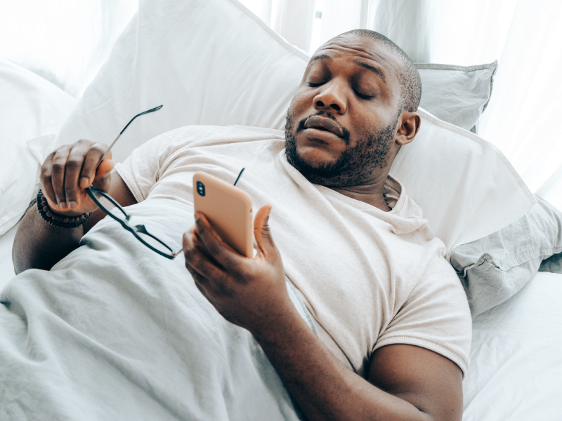 Black man waking up from phone call