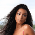 Bonang Matheba posing on a balcony