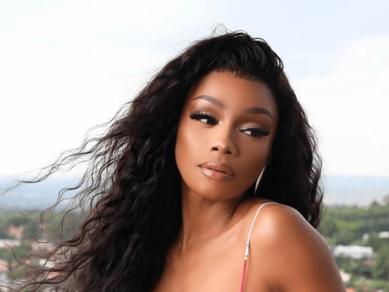 Bonang Matheba posing on a balcony