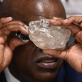 Botswana's President Mokgweetsi Masisi looks at a large diamond discovered in Botswana