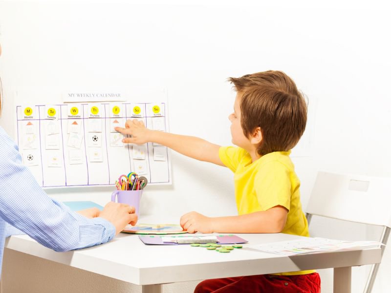 Boys points at calendar
