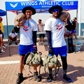 Brian Fell and Kurtis Kinsey standing in front of a Wings Athletic Club gazebo