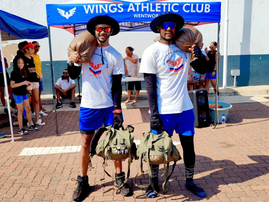 Brian Fell and Kurtis Kenley standing in front of a Wings Athletic Club gazebo