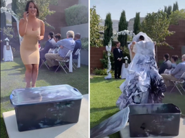 Bride standing at her wedding holding her dyed dress