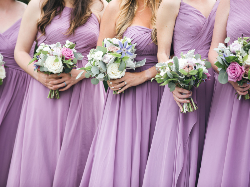 Close up of bridal party with floral bouquets