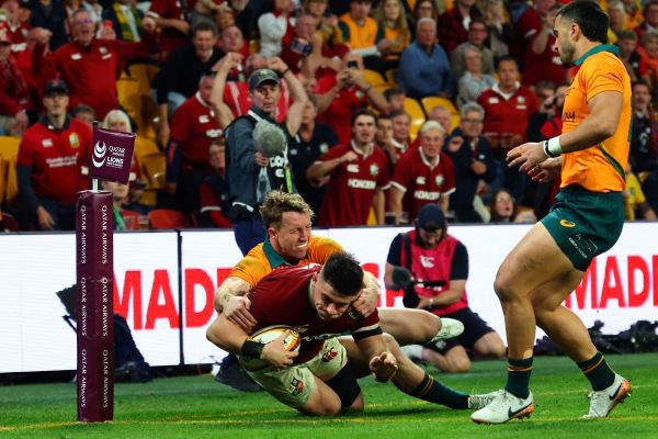 British and Irish Lions' Dan Sheehan scores a try under pressure from Australia's Harry Potter