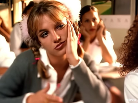 Britney Spears sitting in a classroom