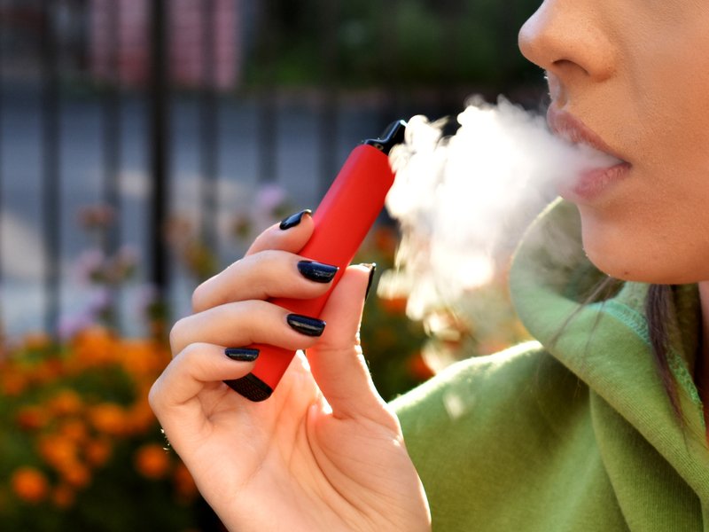 Woman smoking electronic cigarette