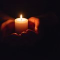 Candle held in hands