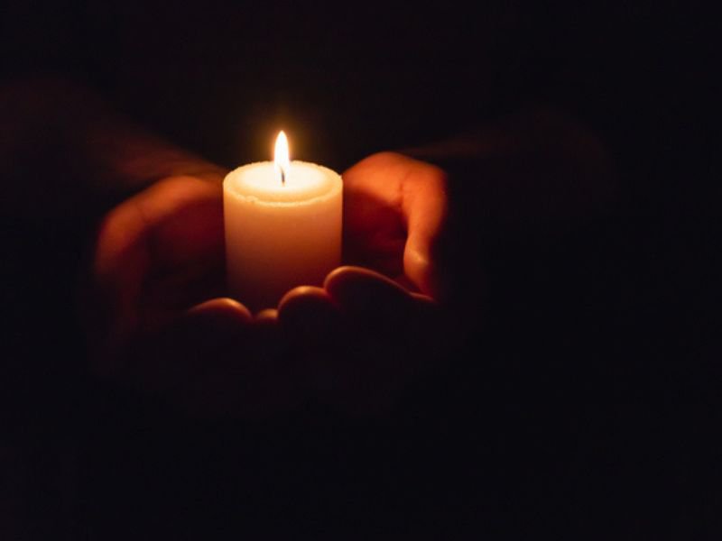 Candle held in hands
