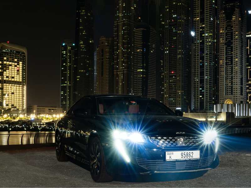 Car parked on a lot at night in Dubai