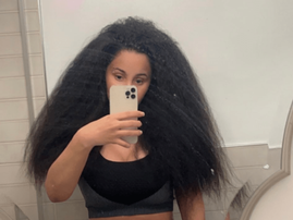 Cardi B shows off her real hair while taking a mirror selfie
