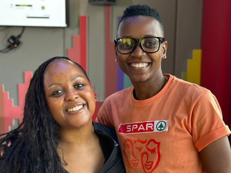 Carol Ofori and Precious Mthembu standing at the East Coast Radio studios