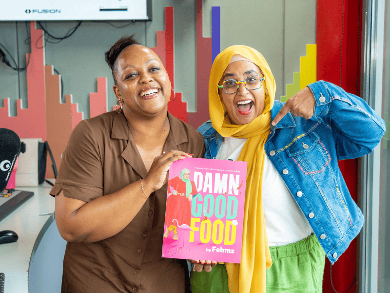 Carol Ofori poses with Fehmz at the East Coast Radio studios