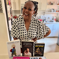 Carol Ofori poses with her top five books of 2025