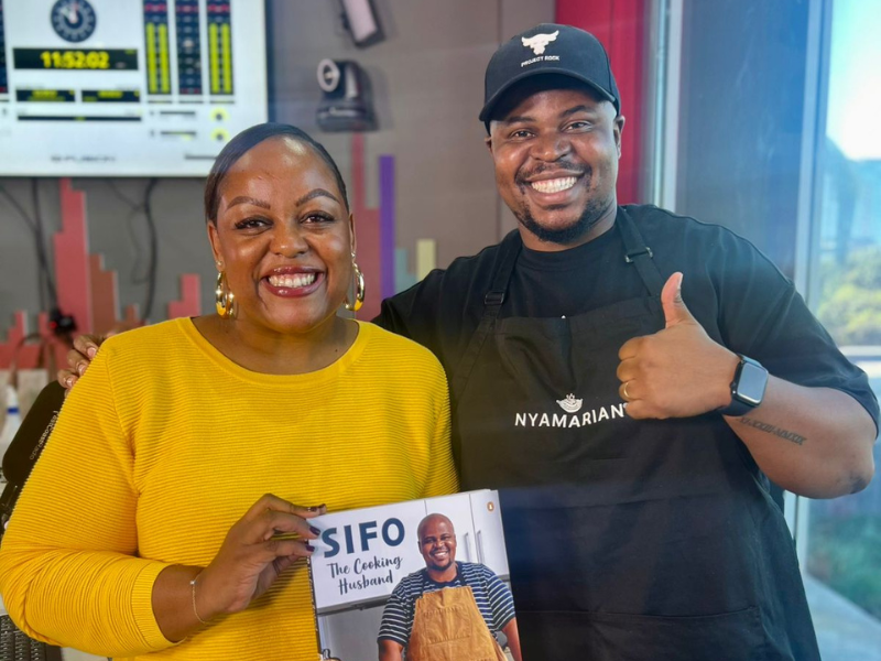 Carol Ofori posing with Sinoyolo Sifo at the East Coast Radio studios