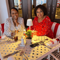 Carol Ofori sits with her mother at a restaurant
