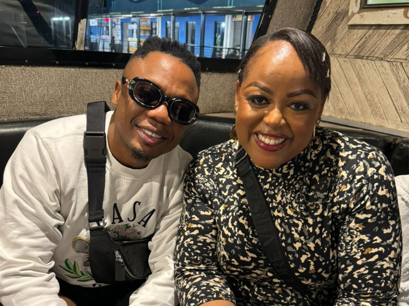 Carol Ofori sitting next to DJ Tira at an event