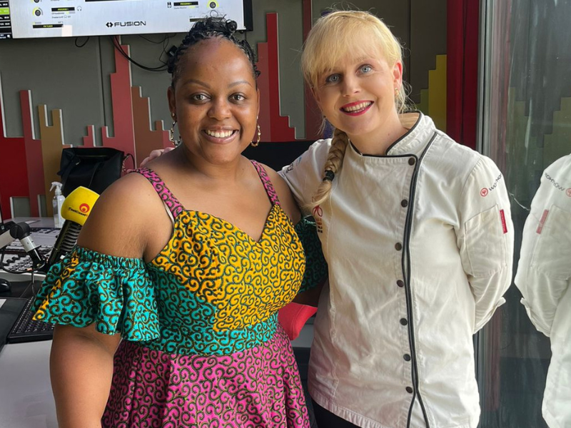 Carol Ofori standing with Jackie Cameron at East Coast Radio studios