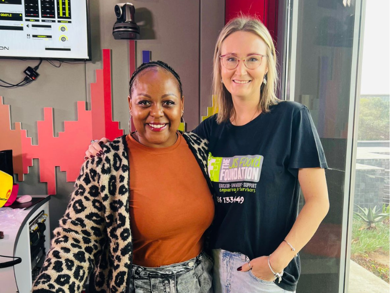 Carol Ofori standing with Jes Foord at the East Coast Radio Studios