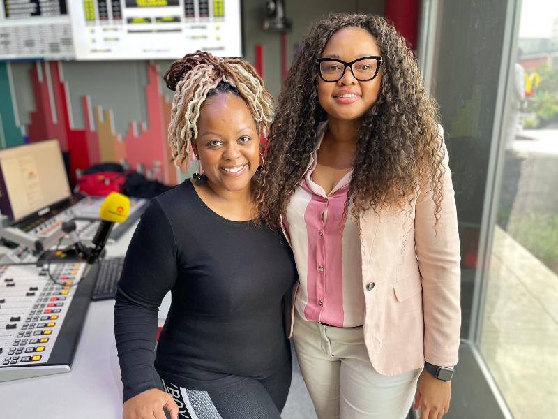 Carol Ofori stands next to Thando Makhunga at East Coast Radio studio