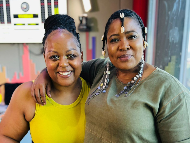 Carol Ofori stands with Thandiswa Mazwai at the East Coast Radio Studios