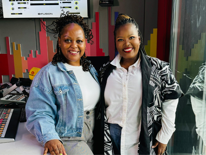 Carol Ofori stands with fashion designer Zama Gumede