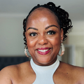Carol Ofori wearing a white dress