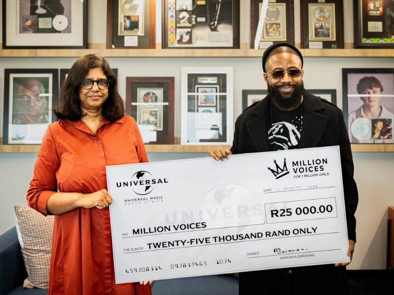 Cassper Nyovest holding Million Voices voucher