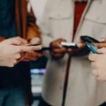 People holding cellphones in circle
