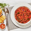 Traditional chakalaka with spoon and crackers