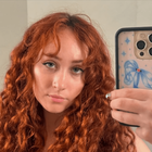 Chappell Roan takes a selfie with an iPhone