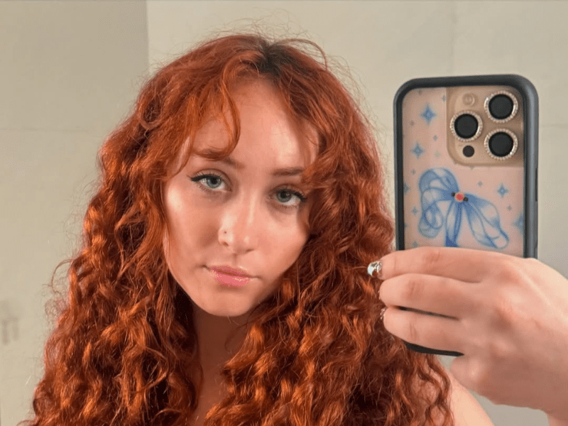 Chappell Roan takes a selfie with an iPhone