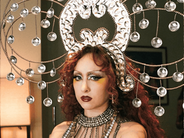 Chappell Roan wearing an elaborate jewel-encrusted headpiece