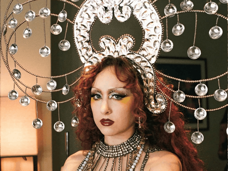 Chappell Roan wearing an elaborate jewel-encrusted headpiece