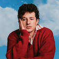 Charlie Puth wearing a red jersey