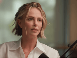 Charlize Theron wearing a white shirt