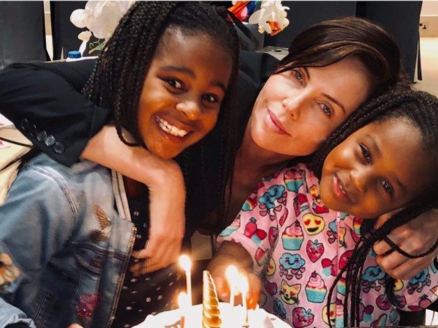 Charlize Theron and her daughters
