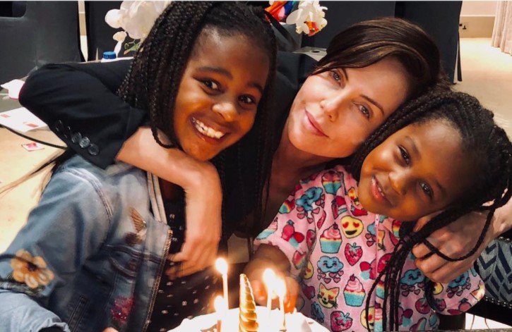 Charlize Theron and her daughters