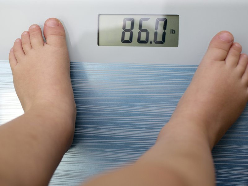 Child on measuring scale