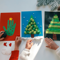 Children creating Christmas cards crafting
