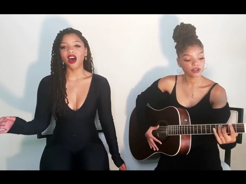 Chloe and Halle Bailey wearing all-black outfits