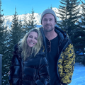 Chris Hemsworth and Elsa Pataky pose in a snowy mountain area